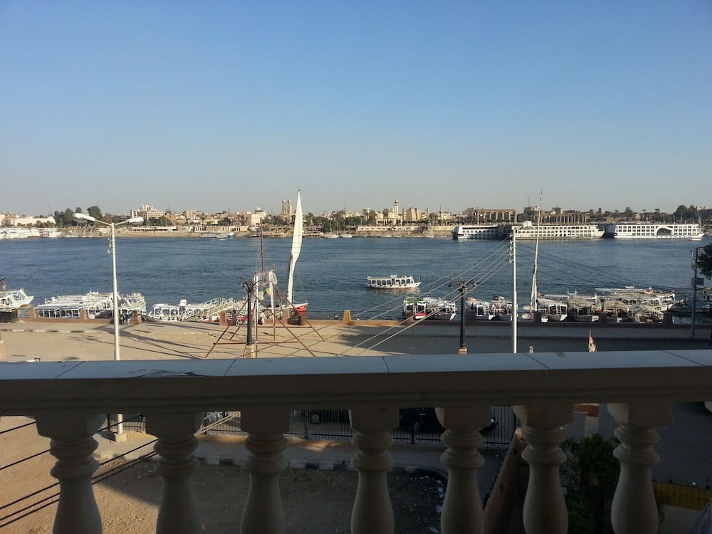 El Mesala Hotel balcony with a stone balustrade and river view.