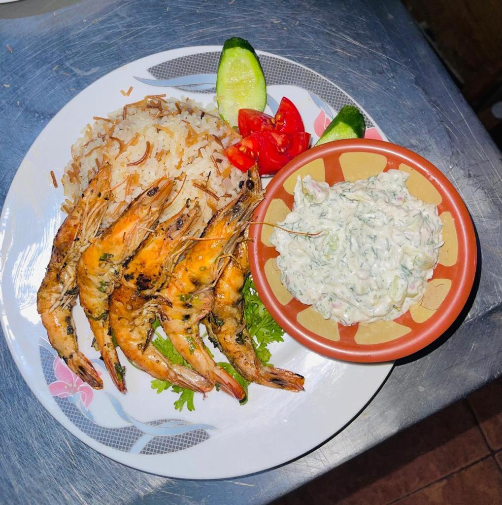 El Mesala Hotel Luxor seafood plate with prawns and rice.