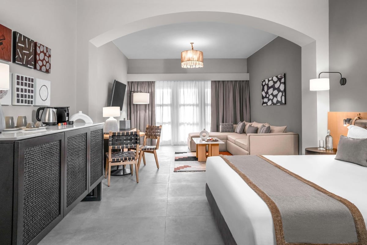 Steigenberger Golf Resort El Gouna guest suite with a bed and sitting area.