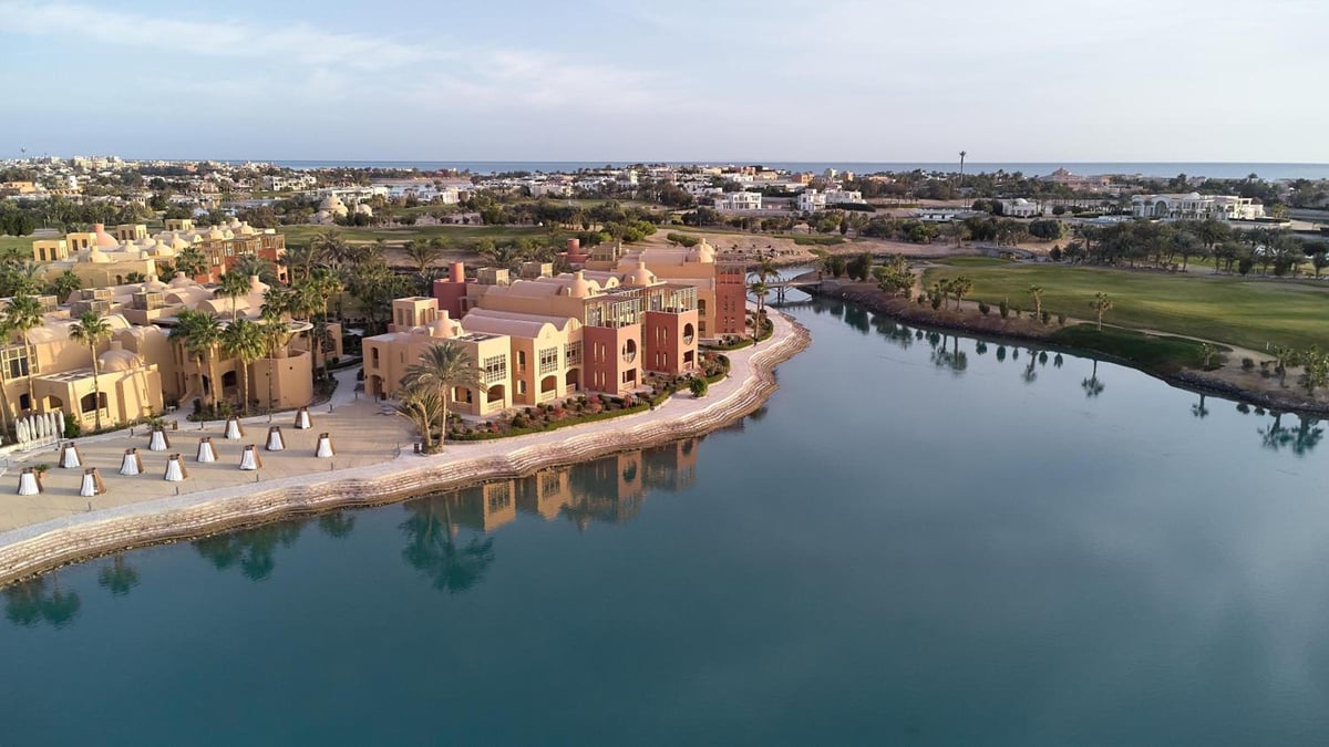 Steigenberger Golf Resort El Gouna resort grounds with pink buildings and a lagoon.