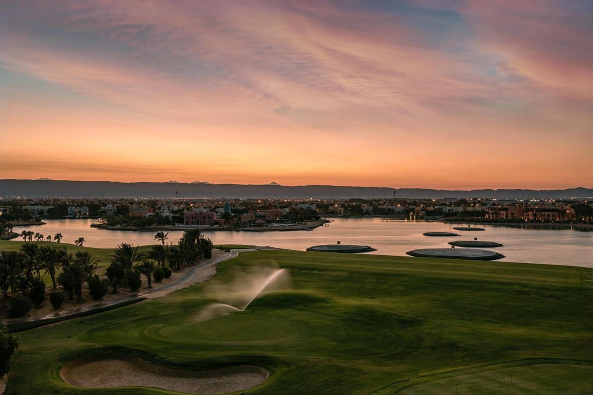 Steigenberger Golf Resort El Gouna golf course with green fairways and a lagoon.