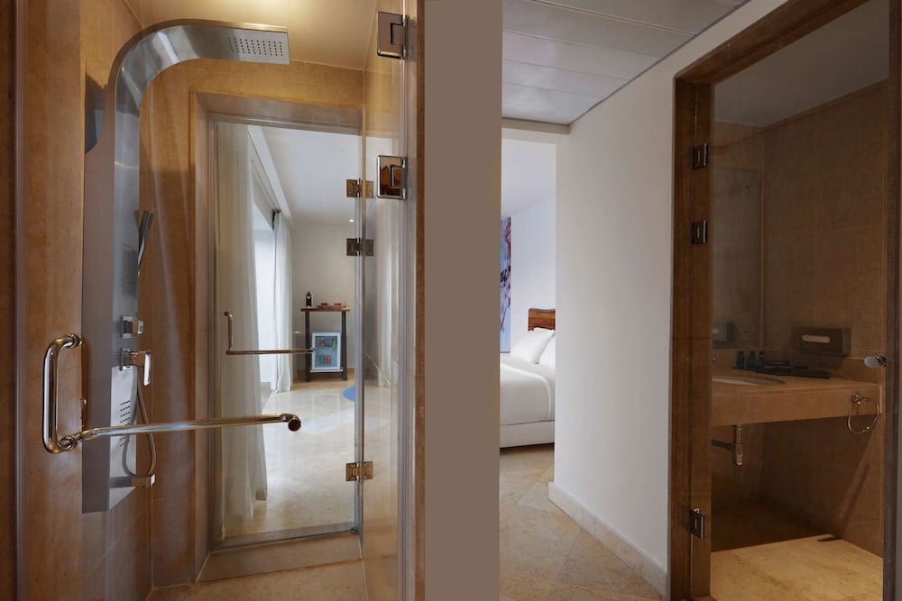 Steigenberger Pure Lifestyle (Adults Only) bathroom with a glass shower and a vanity.