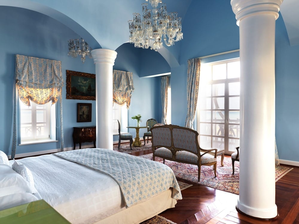 La Maison Bleue El Gouna bedroom with a large bed and blue vaulted ceiling.
