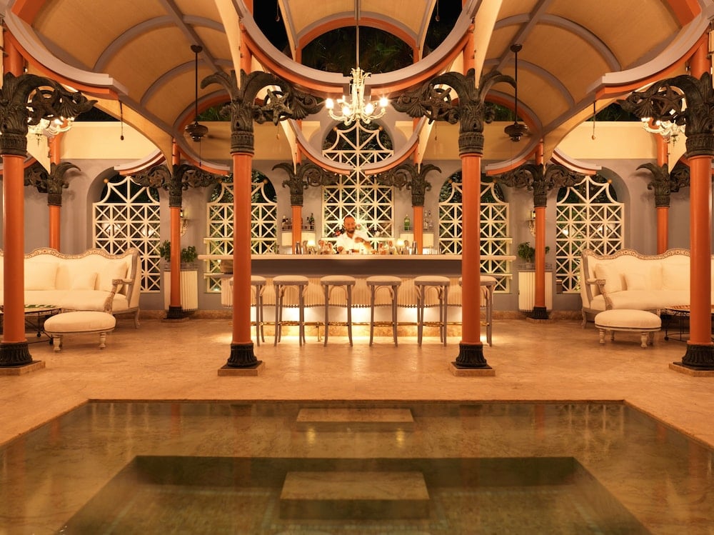 La Maison Bleue El Gouna lobby with a shallow pool and vaulted ceiling.