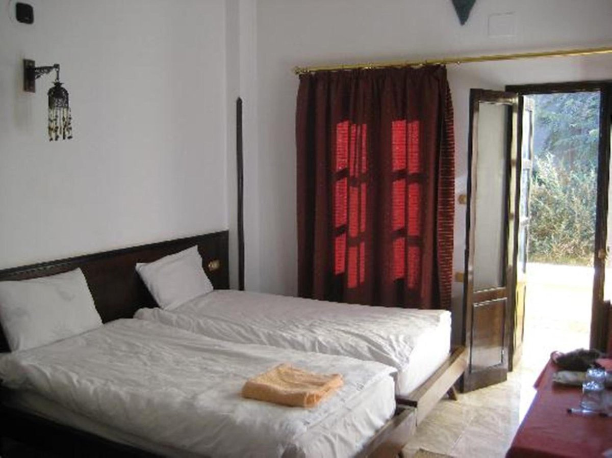 El Nakhil Hotel Luxor twin room with two beds and an open doorway.