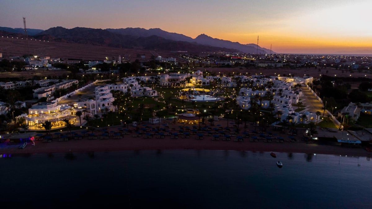 Safir Dahab Resort grounds with low-rise buildings and a beachfront.