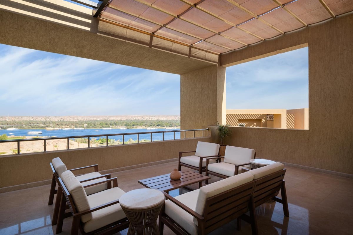 The Zen Wellness Resort Aswan terrace with lounge seating and a water view.