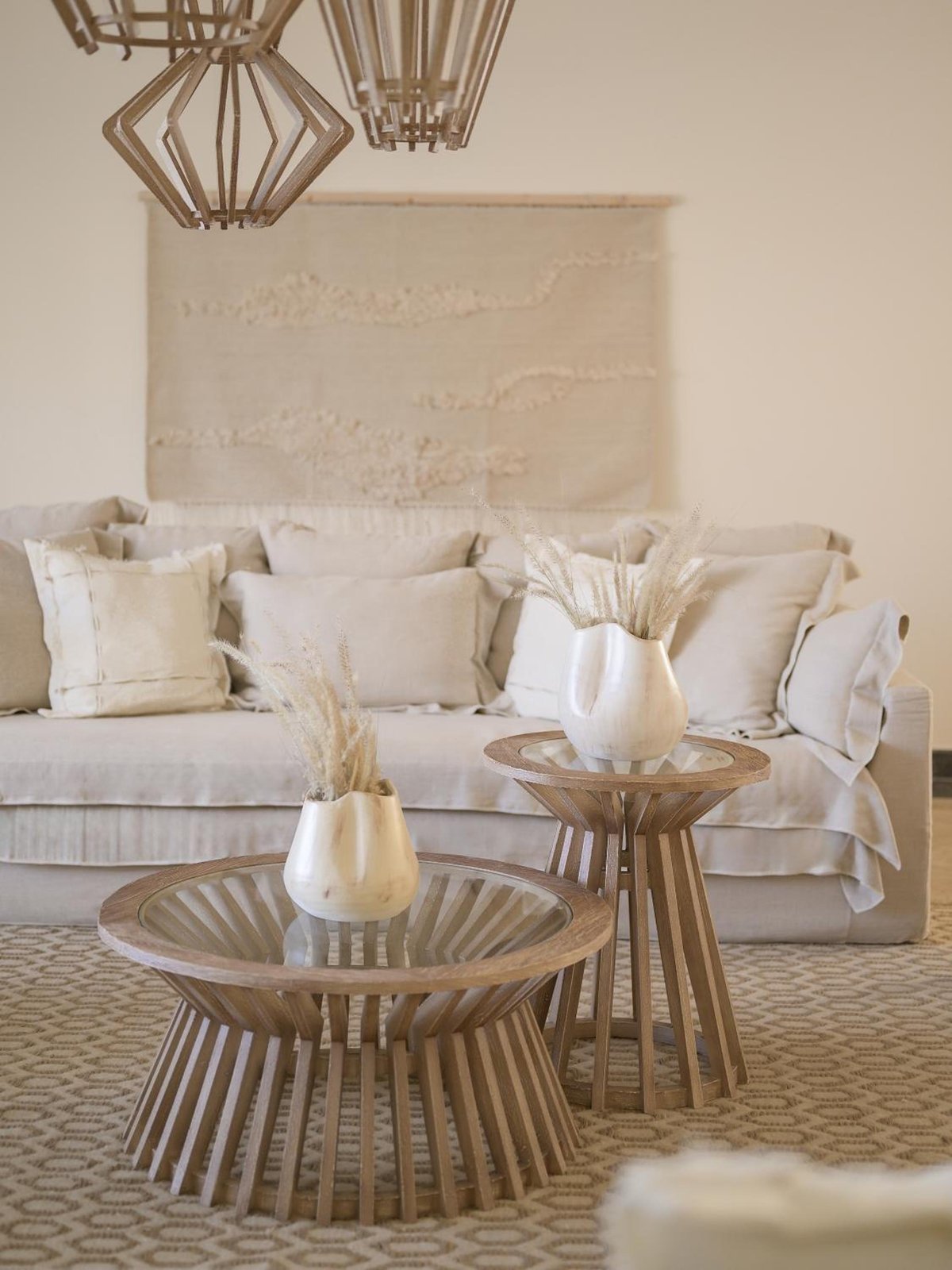 The Zen Wellness Resort Aswan lounge with a pale sectional sofa and woven tables.