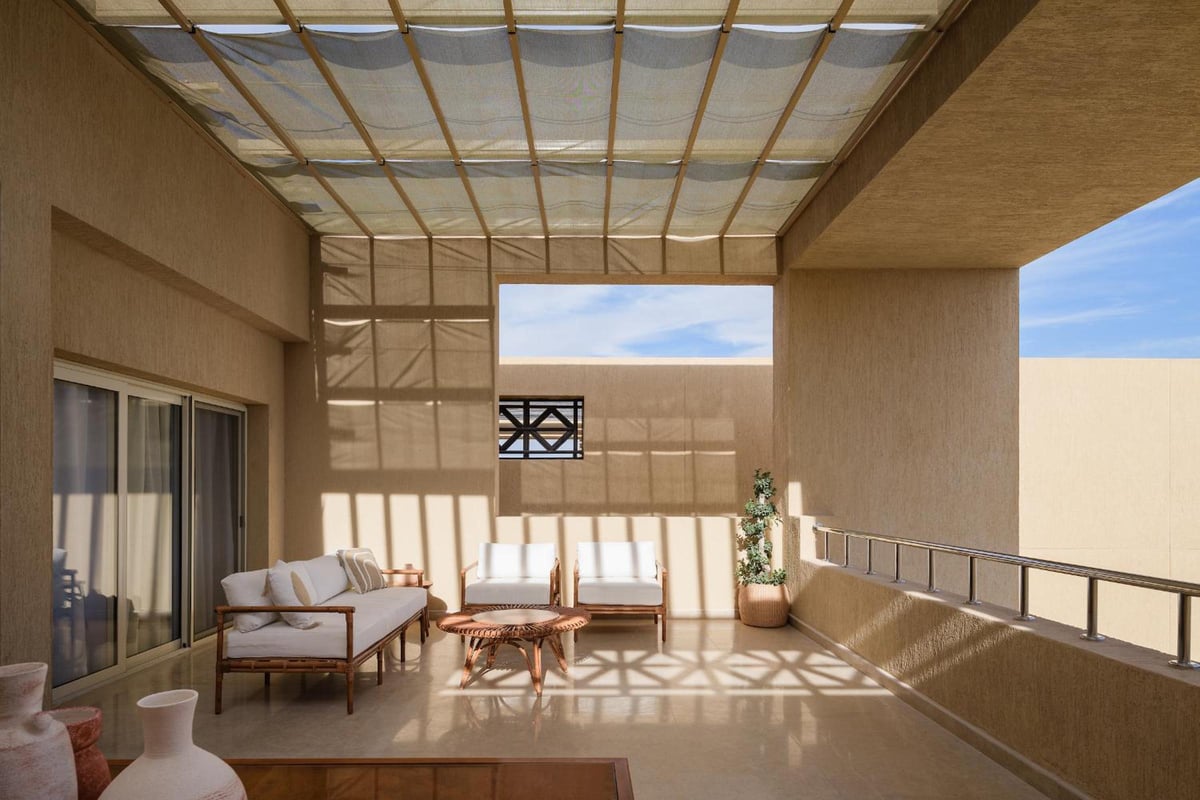 The Zen Wellness Resort Aswan terrace with a lattice canopy and lounge seating.